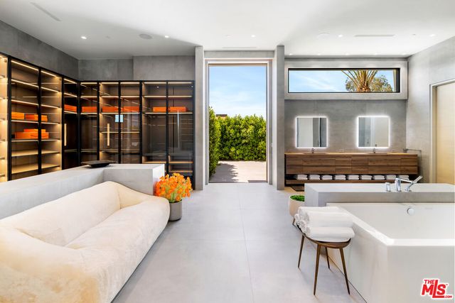 a kitchen with a table chairs stove and kitchen view