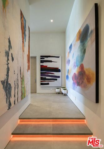 a large kitchen with kitchen island a sink a stove and a refrigerator