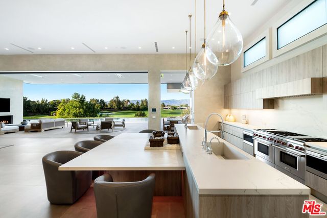 a kitchen with a white cabinets and white appliances