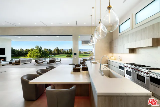 a kitchen with a white cabinets and white appliances
