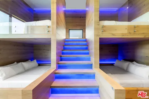 a living room with furniture fireplace and a large window