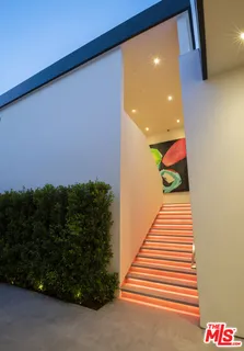 a bedroom with a bed and a fireplace