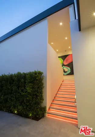 a bedroom with a bed and a fireplace