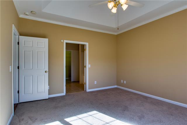 306 Eastside Road Burns, TN 37029 - Photo 11 of 19 The tray ceiling opens the room....