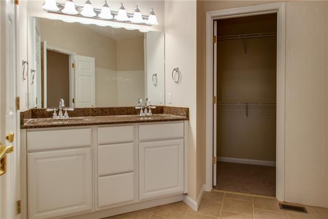 306 Eastside Road Burns, TN 37029 - Photo 12 of 19 And look at the bathroom! Lots of renovation with new double vanity and granite, fixtures, and porcelain tile flooring....