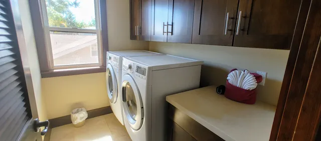 a view of a hallway with a kitchen