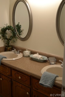 5513 Gatebridge Road North Chesterfield, VA 23234 - Photo 16 of 24 a bathroom with a sink and a mirror