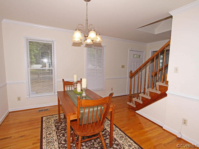 5513 Gatebridge Road North Chesterfield, VA 23234 - Photo 3 of 24 a view of a dining room with furniture window and wooden floor