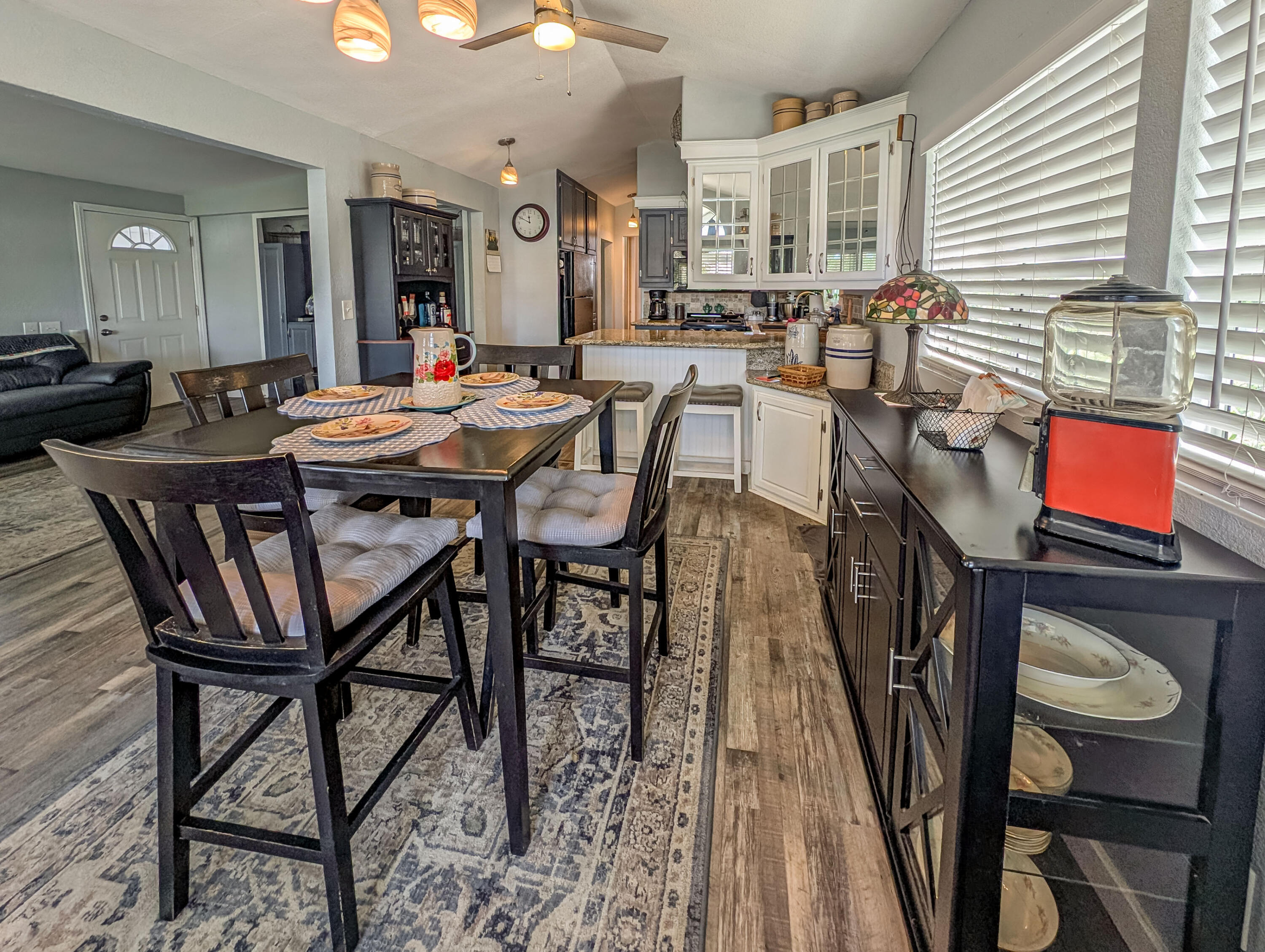 70200 Dillon Road, Unit 665 Desert Hot Springs, CA 92241 - Photo 12 of 40 a outdoor dining space with furniture and wooden floor