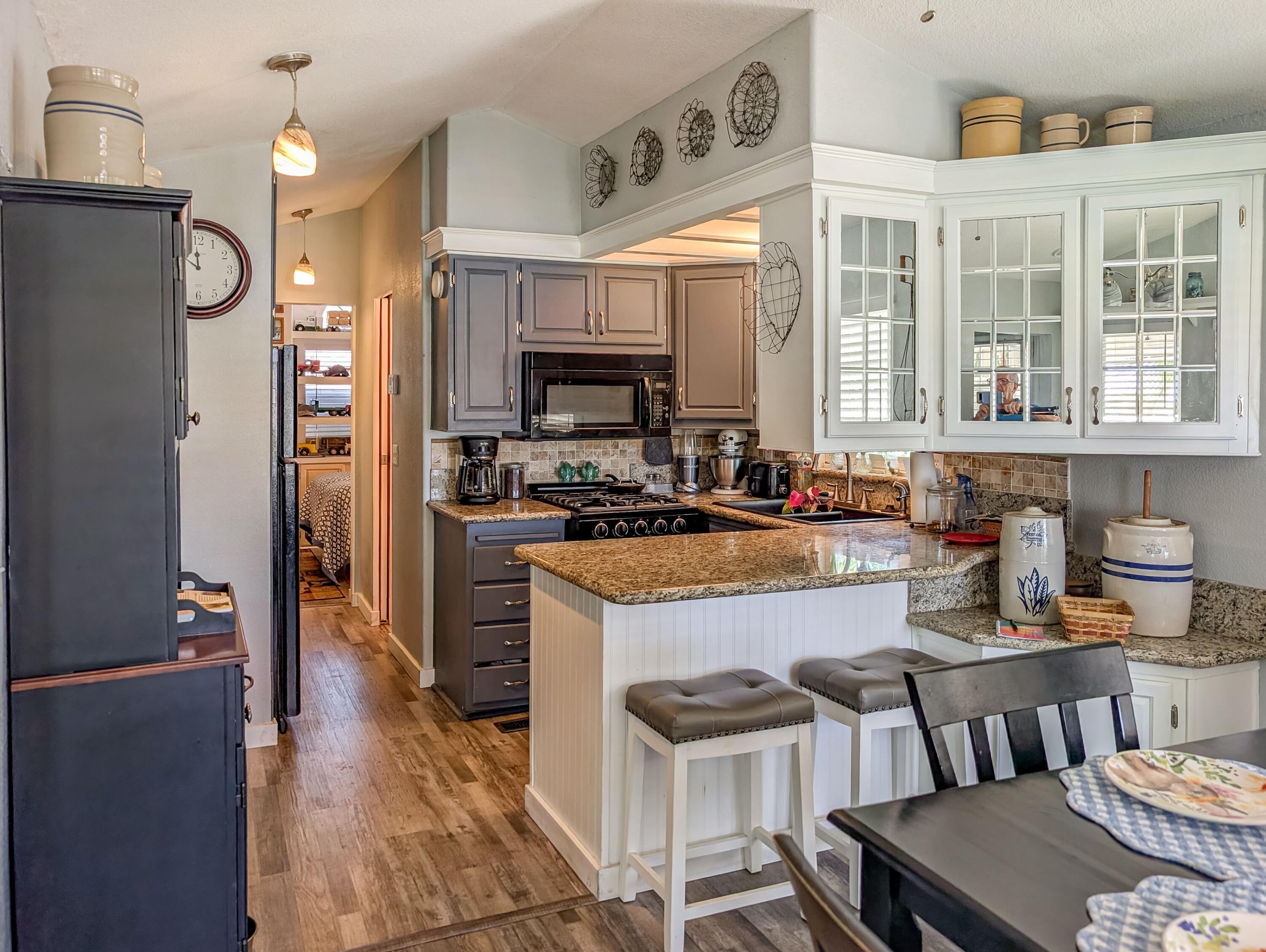 70200 Dillon Road, Unit 665 Desert Hot Springs, CA 92241 - Photo 13 of 40 a kitchen with granite countertop lots of counter top space and stainless steel appliances