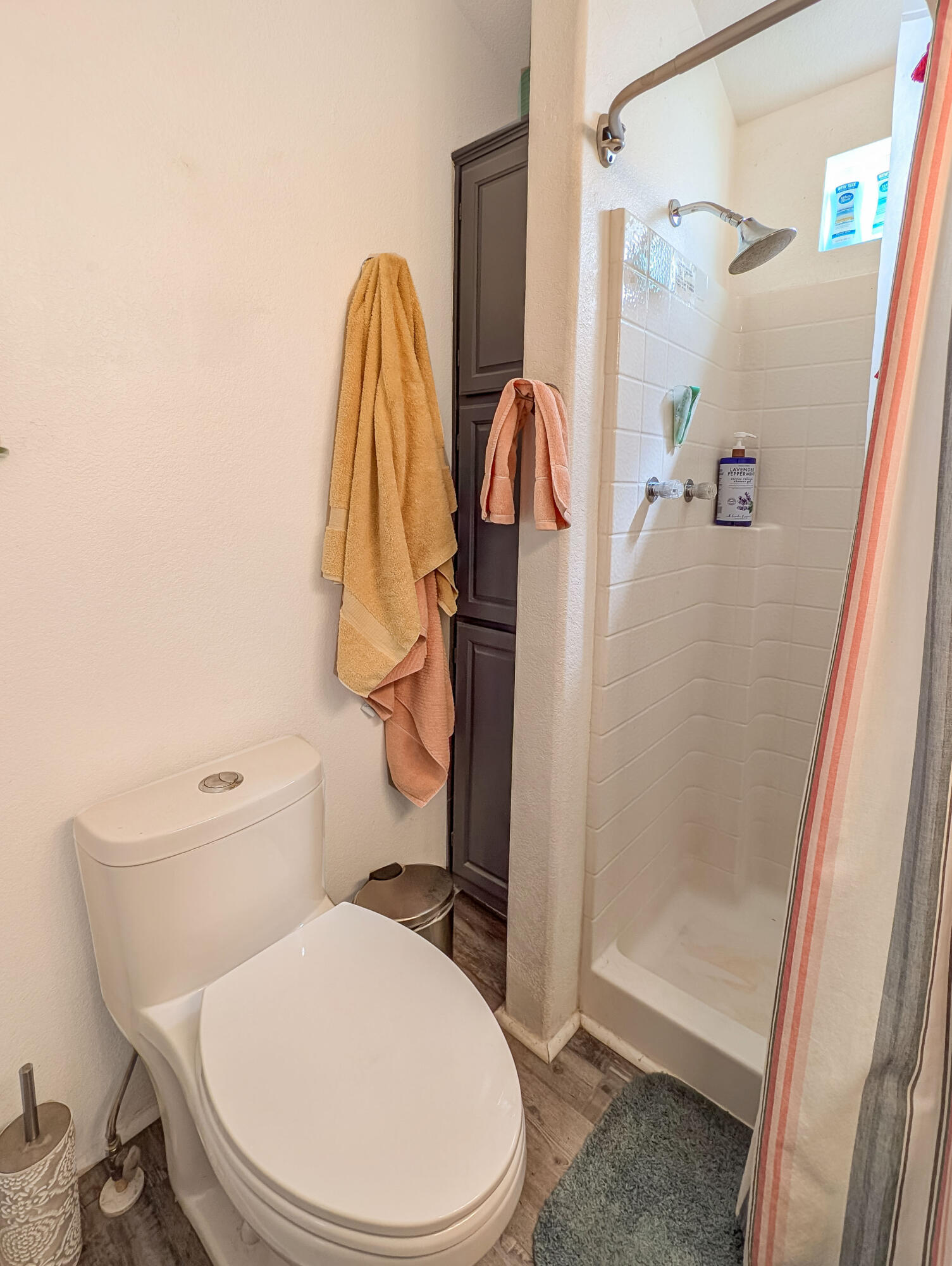 70200 Dillon Road, Unit 665 Desert Hot Springs, CA 92241 - Photo 18 of 40 a white toilet sitting next to a bath tub shower