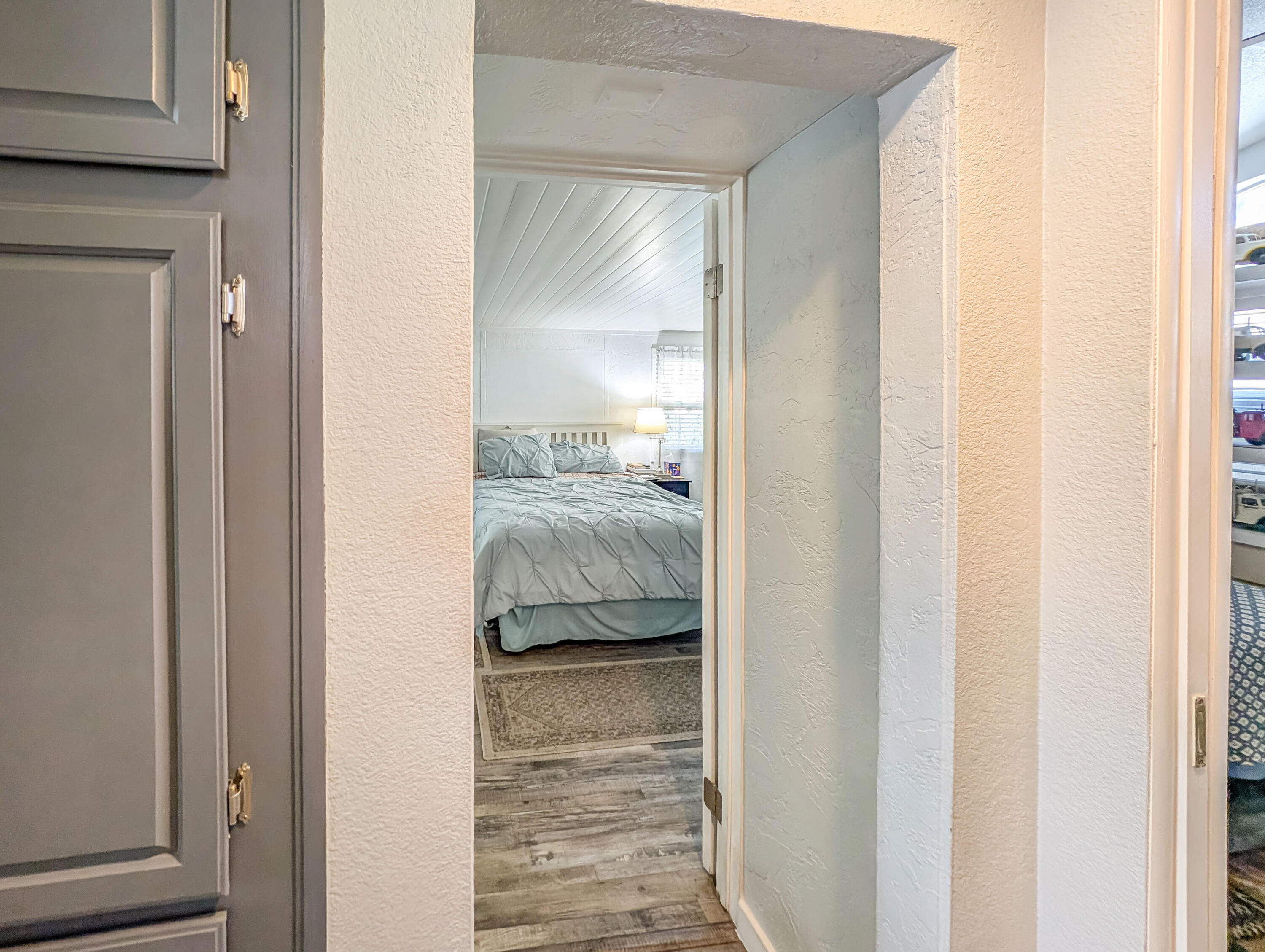 70200 Dillon Road, Unit 665 Desert Hot Springs, CA 92241 - Photo 23 of 40 a view of a bedroom from a hallway