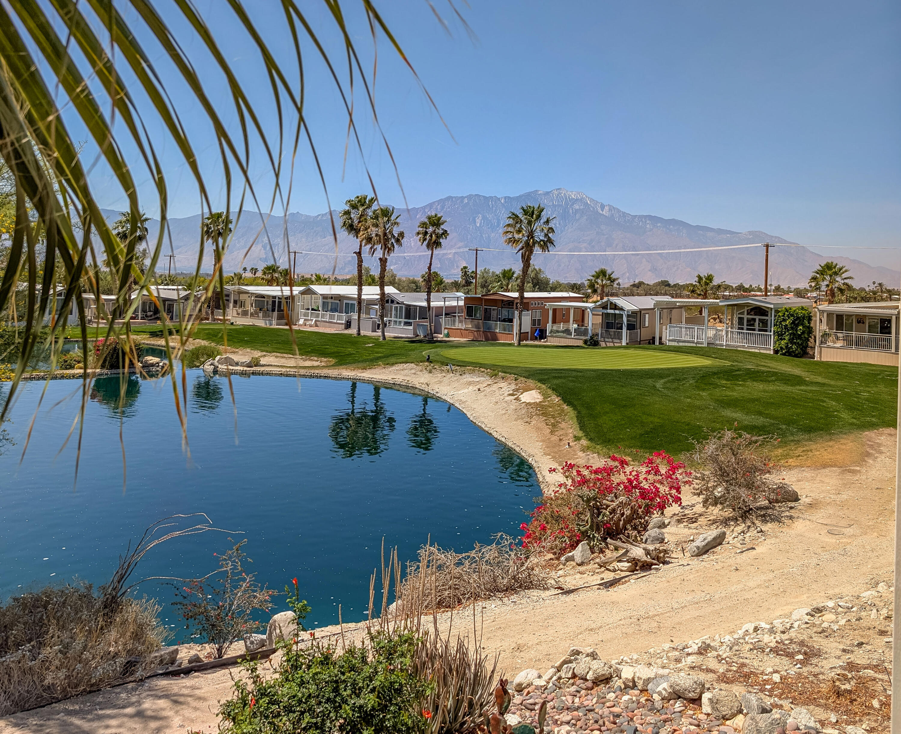 70200 Dillon Road, Unit 665 Desert Hot Springs, CA 92241 - Photo 30 of 40 a view of a house with a yard