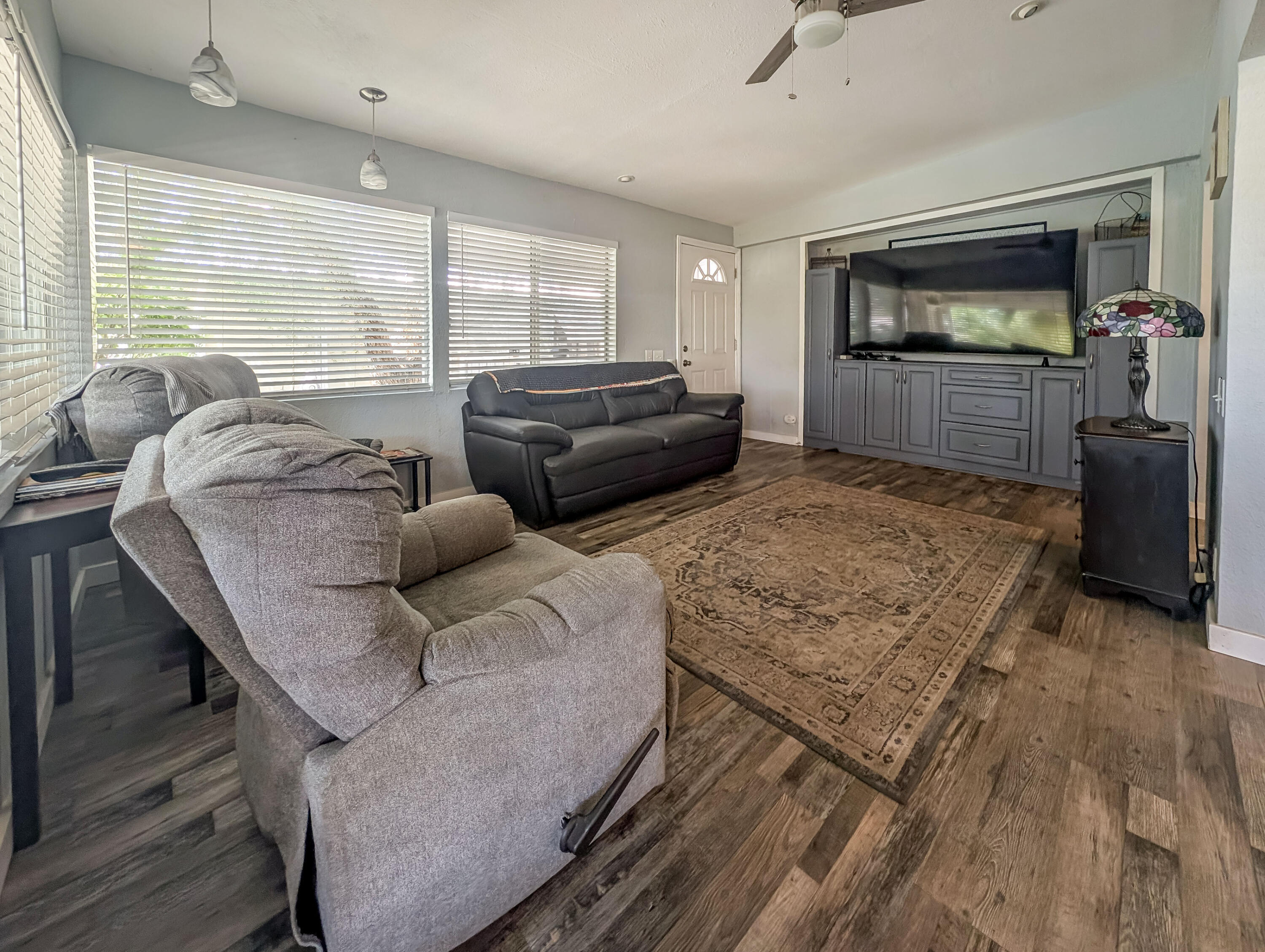 70200 Dillon Road, Unit 665 Desert Hot Springs, CA 92241 - Photo 9 of 40 a living room with furniture and a flat screen tv