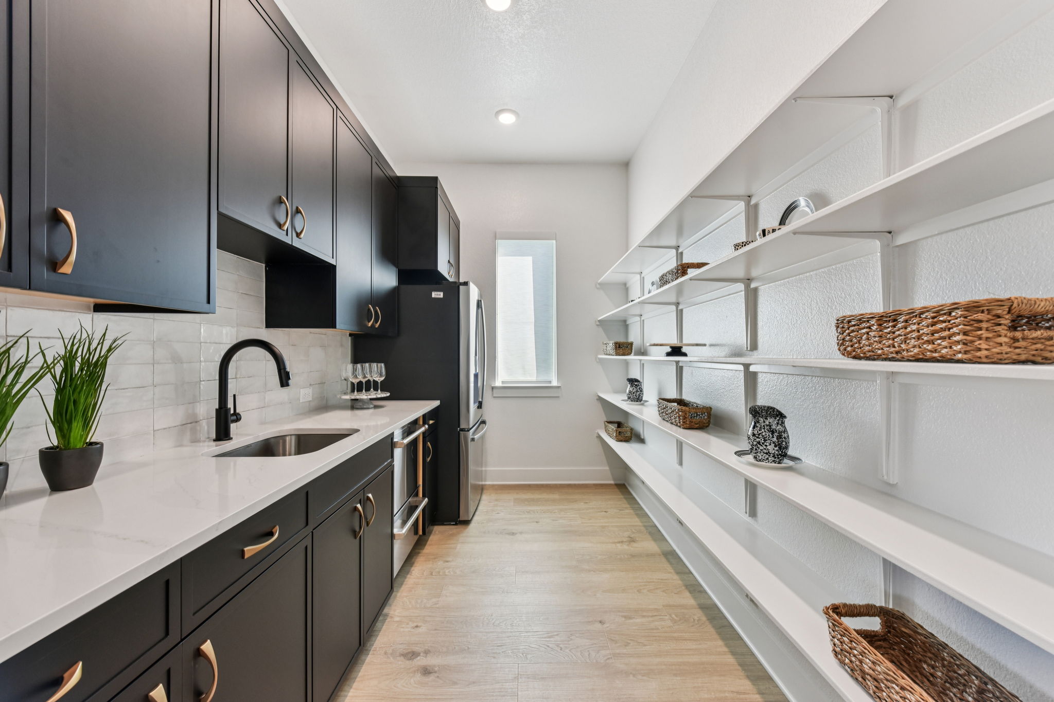208 Winters Cove Georgetown, TX 78633 - Photo 13 of 37 a large kitchen with stainless steel appliances lots of counter space and a sink