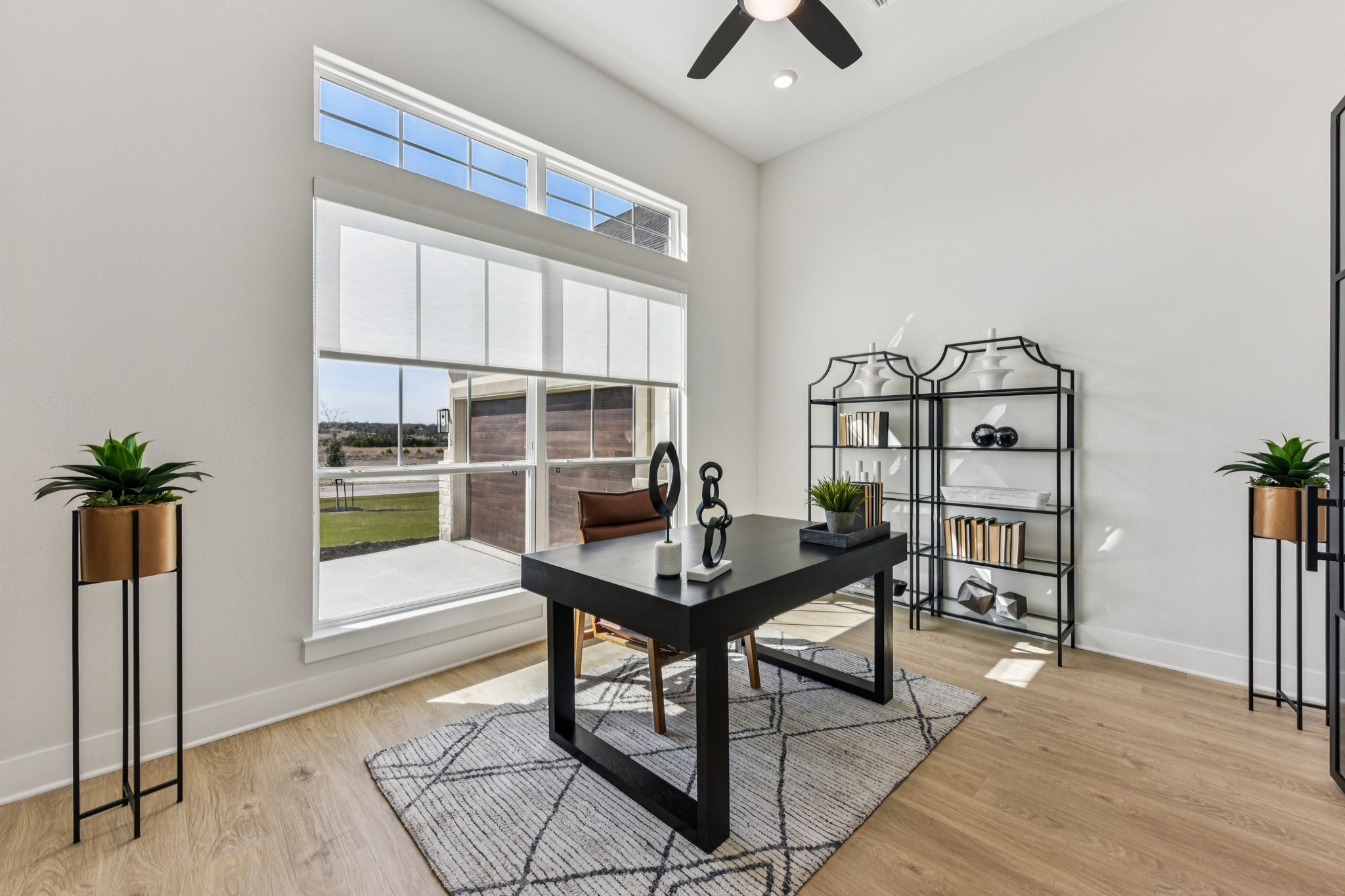 208 Winters Cove Georgetown, TX 78633 - Photo 14 of 37 a view of a workspace with furniture and a window