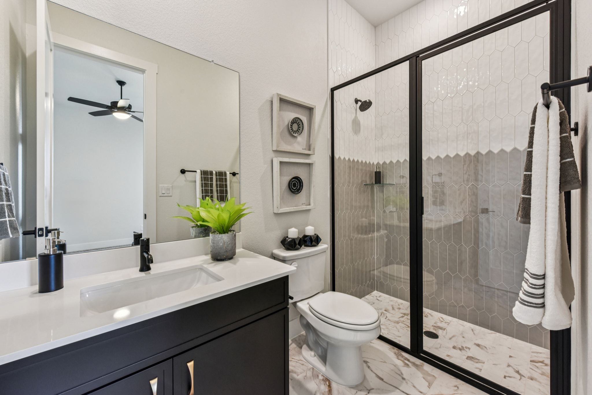 208 Winters Cove Georgetown, TX 78633 - Photo 18 of 37 a bathroom with a granite countertop sink a toilet and shower