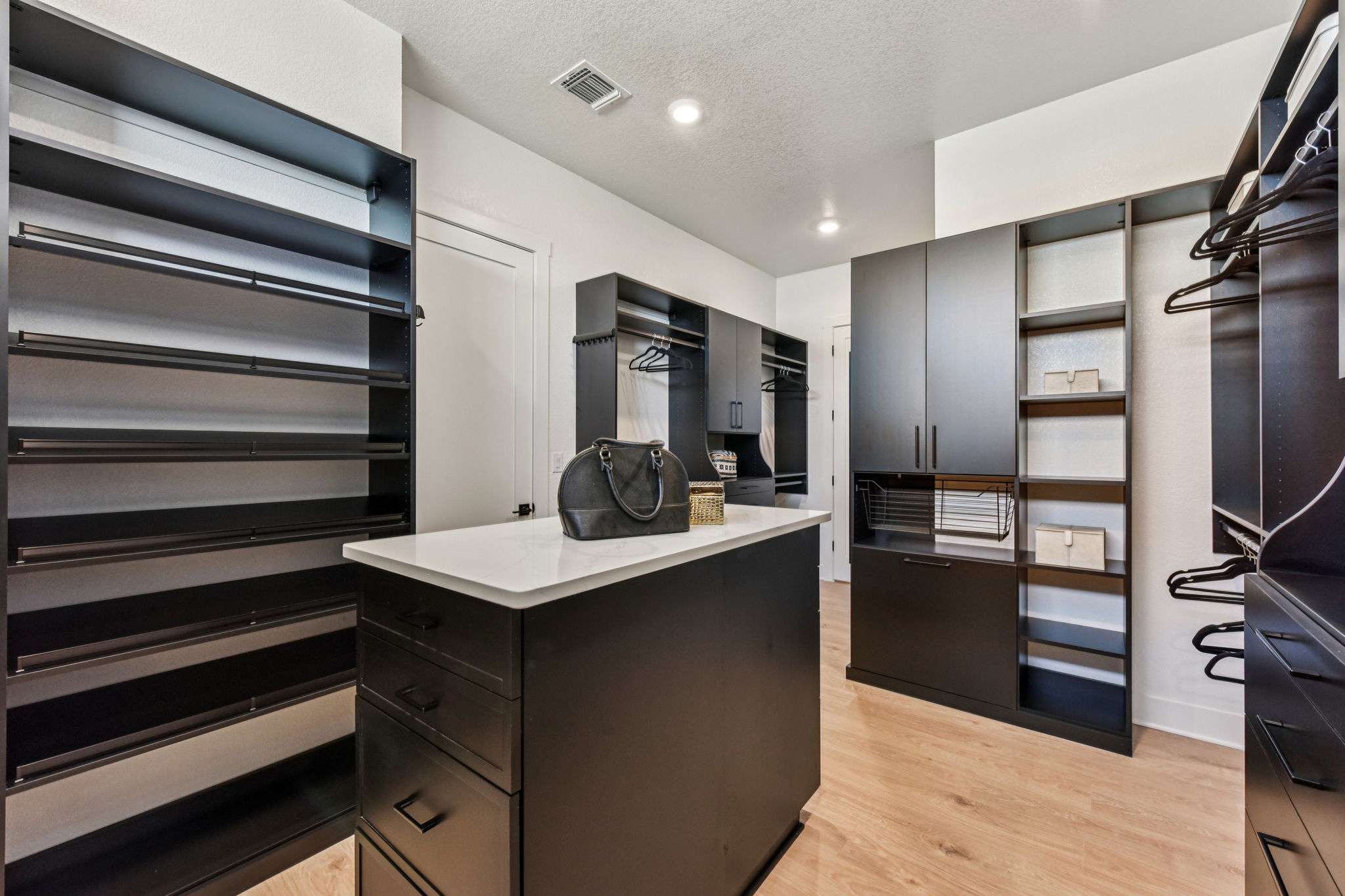 208 Winters Cove Georgetown, TX 78633 - Photo 27 of 37 a kitchen with stainless steel appliances kitchen island granite countertop a refrigerator and a stove top oven