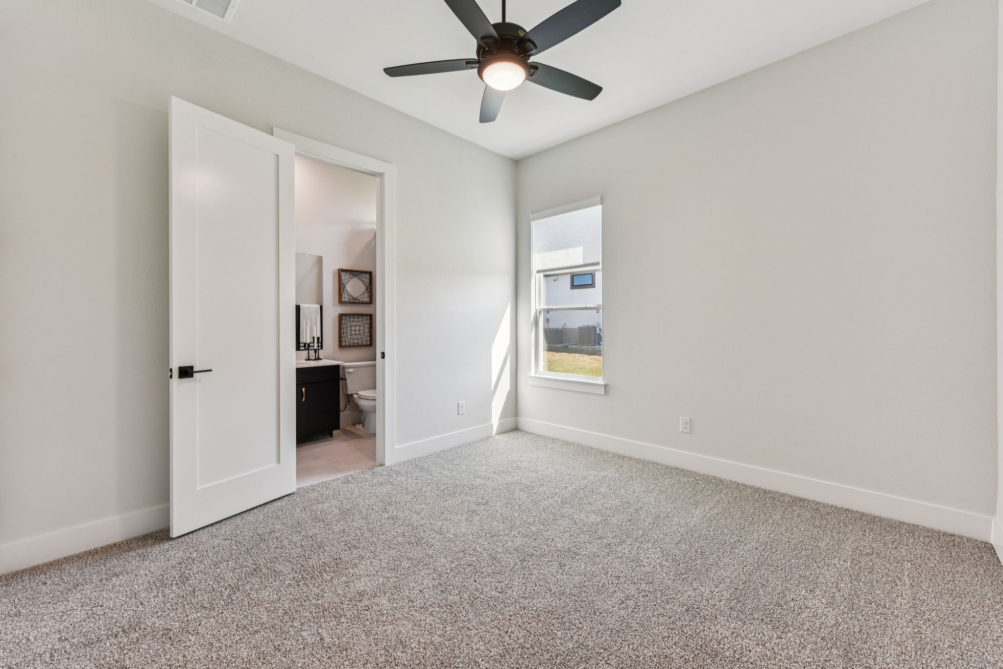 208 Winters Cove Georgetown, TX 78633 - Photo 31 of 37 an empty room with closet and windows