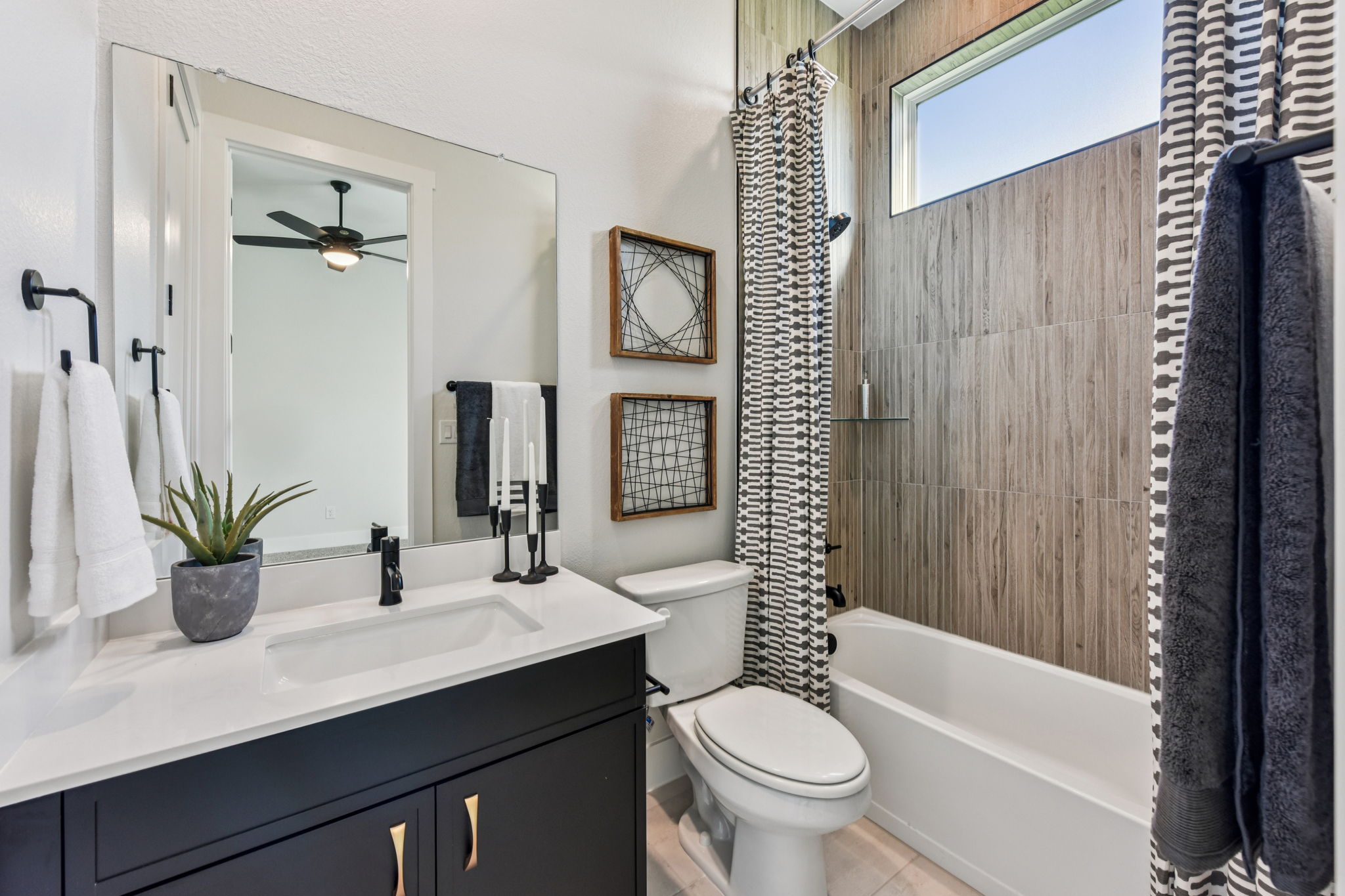 208 Winters Cove Georgetown, TX 78633 - Photo 32 of 37 a bathroom with a sink a toilet a tub and shower