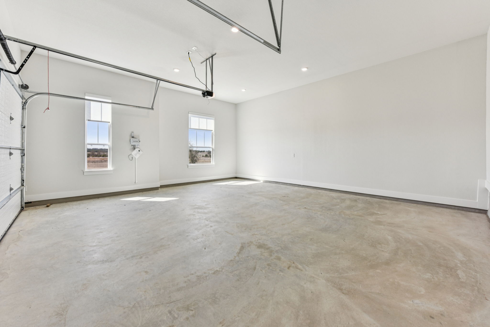 208 Winters Cove Georgetown, TX 78633 - Photo 35 of 37 en empty room with windows and ceiling fan