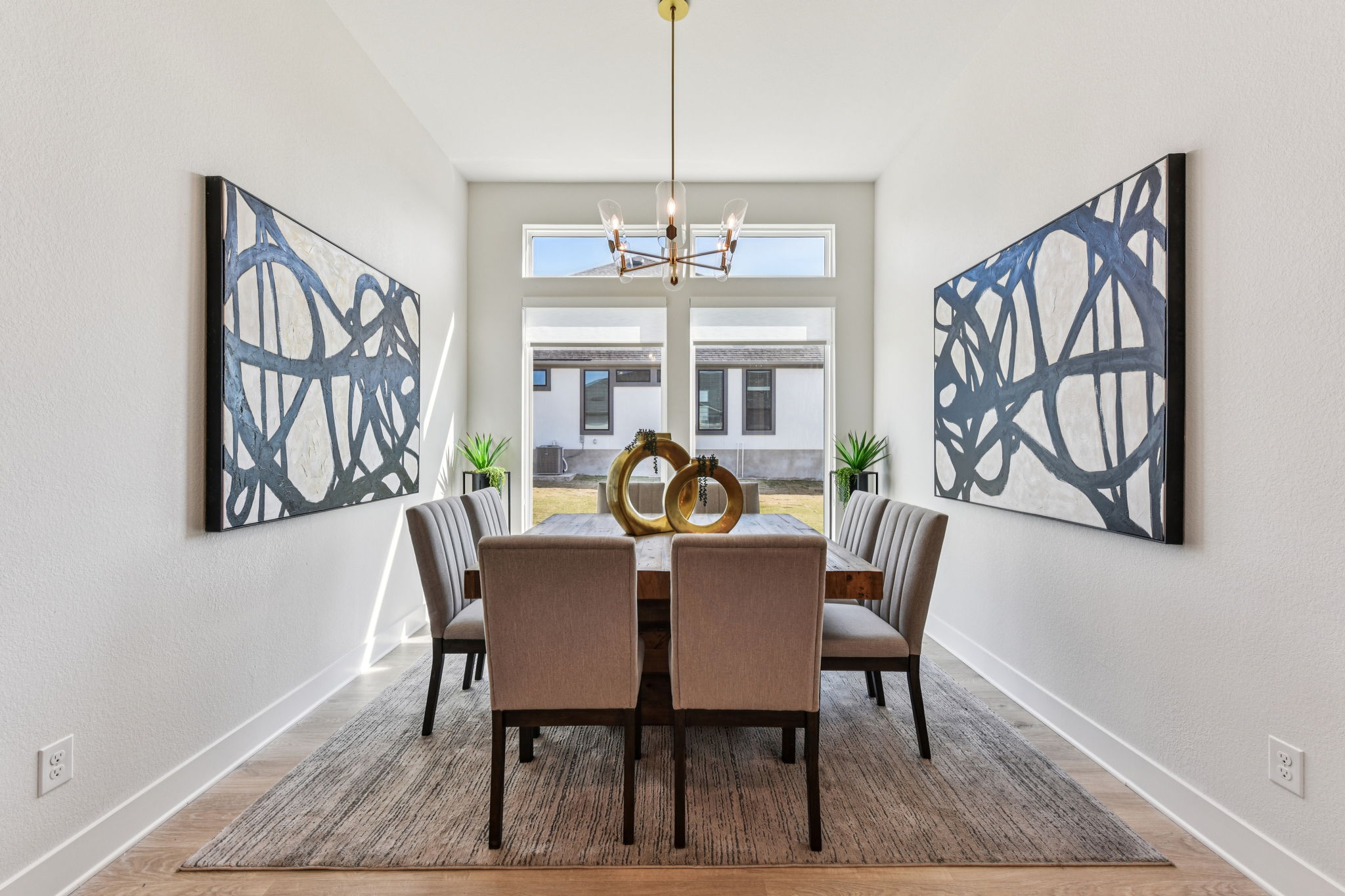 208 Winters Cove Georgetown, TX 78633 - Photo 9 of 37 a view of a dining room with furniture window and wooden floor