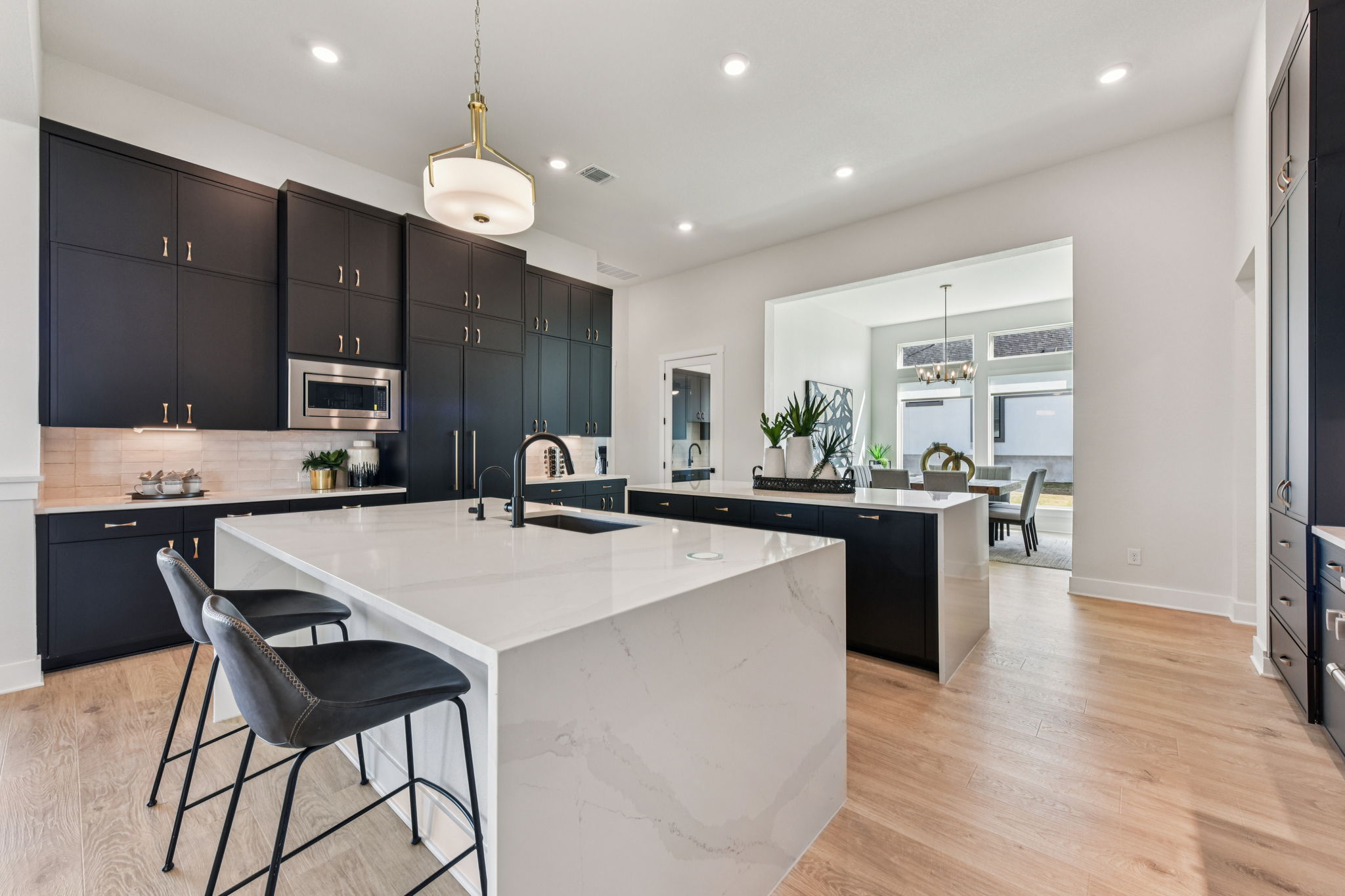 208 Winters Cove Georgetown, TX 78633 - Photo 10 of 37 a open kitchen with stainless steel appliances granite countertop a stove top oven a sink refrigerator and cabinets