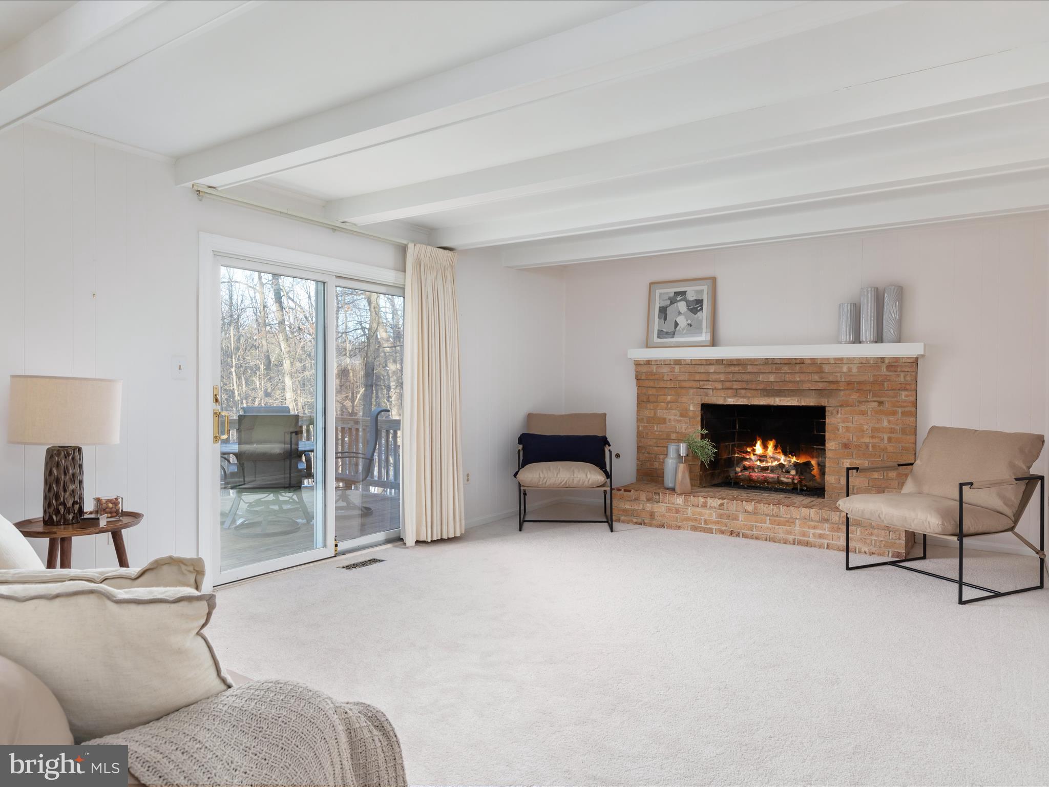10821 Cross School Road Reston, VA 20191 - Photo 17 of 50 a living room with furniture and a fireplace