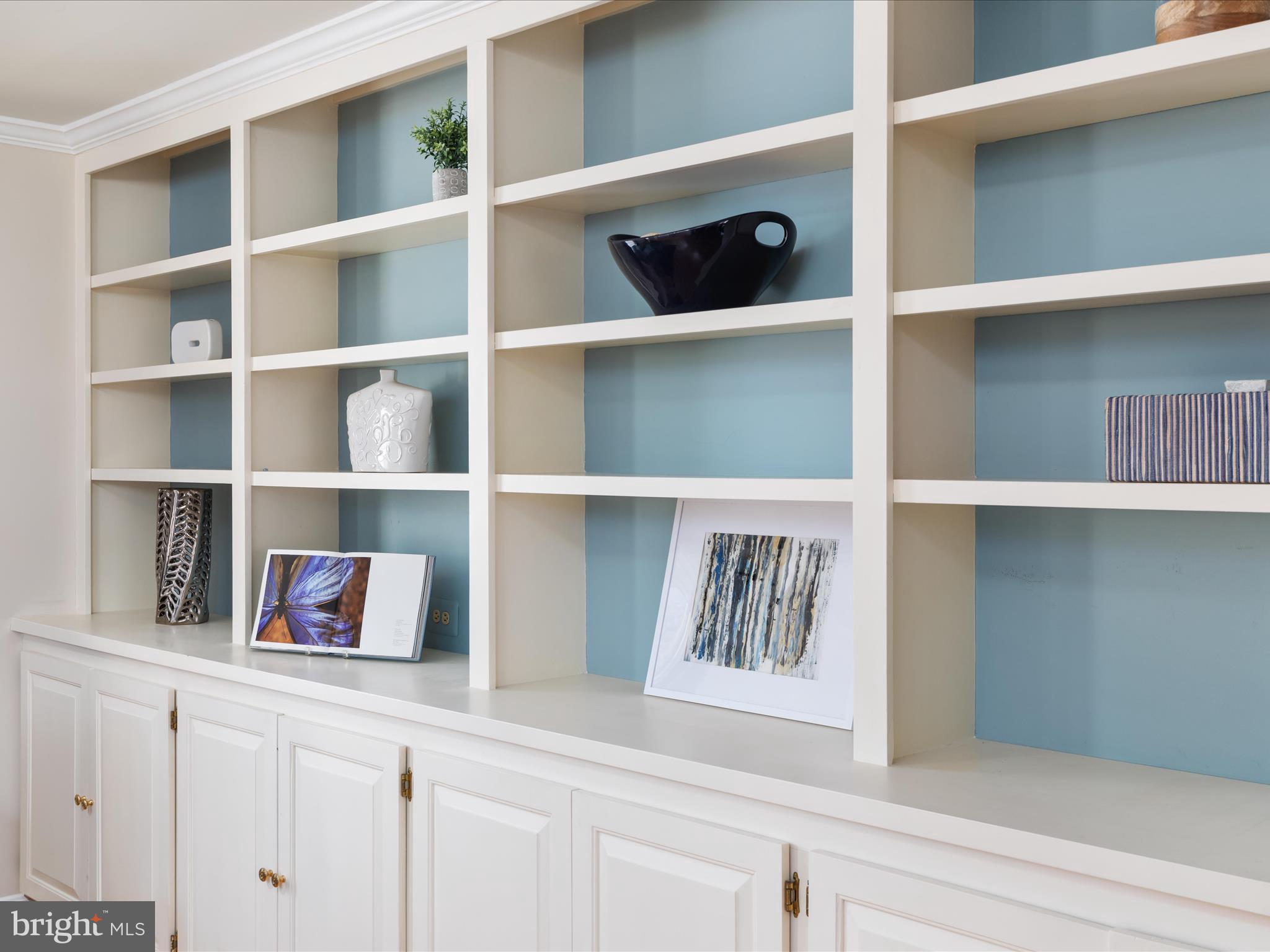 10821 Cross School Road Reston, VA 20191 - Photo 6 of 50 a cabinet with a book shelf on the shelf