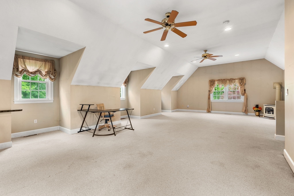 122 Depot Road Boxford, MA 01921 - Photo 18 of 41 a view of a livingroom with a ceiling fan and window
