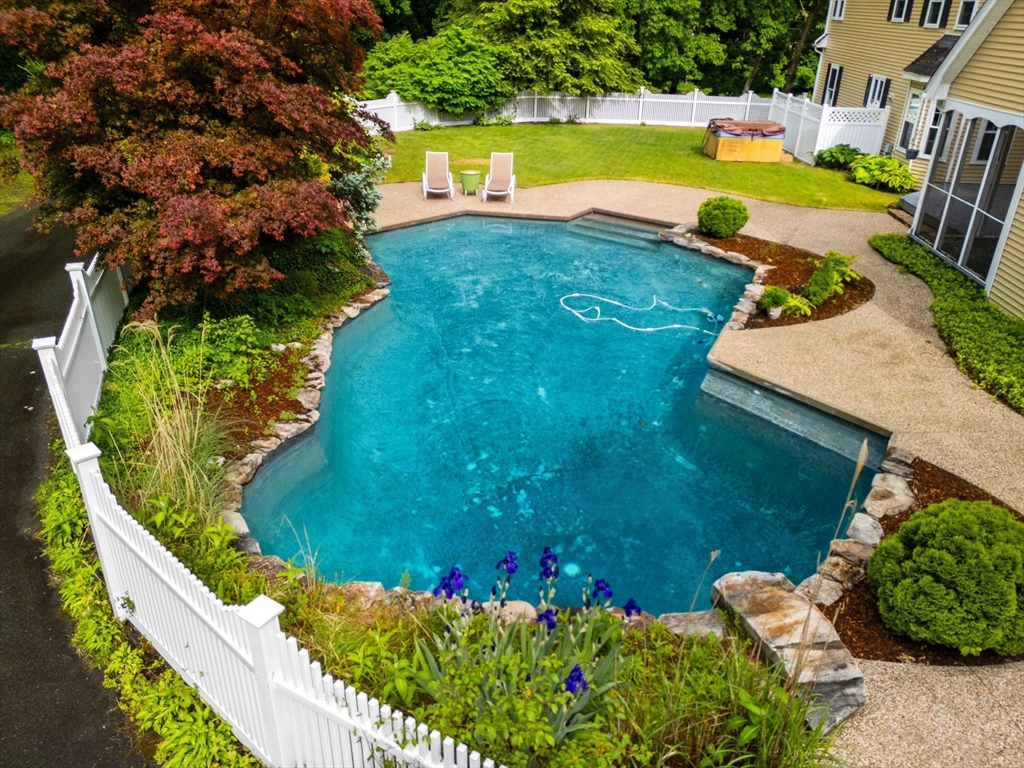 122 Depot Road Boxford, MA 01921 - Photo 3 of 41 a view of a swimming pool with an outdoor space and seating area