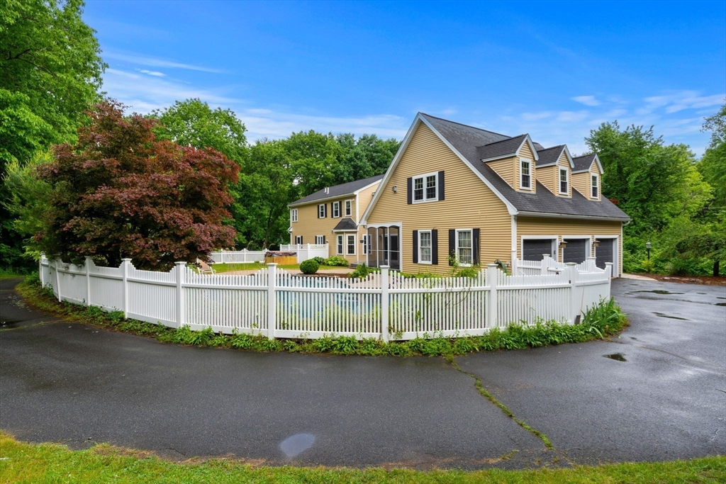 122 Depot Road Boxford, MA 01921 - Photo 32 of 41 a front view of a house with a yard and garage