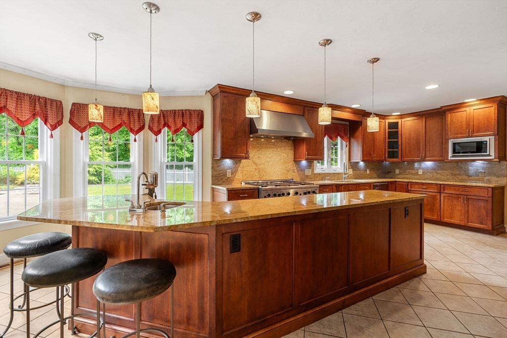 122 Depot Road Boxford, MA 01921 - Photo 6 of 41 a kitchen with stainless steel appliances granite countertop a stove a sink and a wooden floors