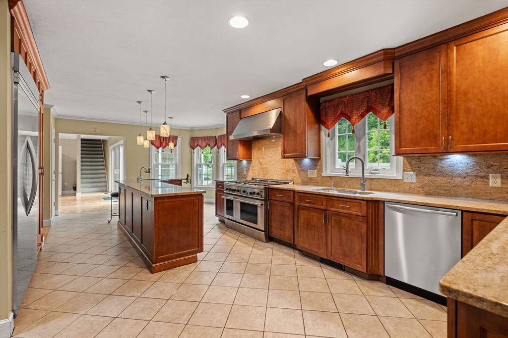 122 Depot Road Boxford, MA 01921 - Photo 7 of 41 a kitchen with stainless steel appliances granite countertop a stove a sink and a microwave