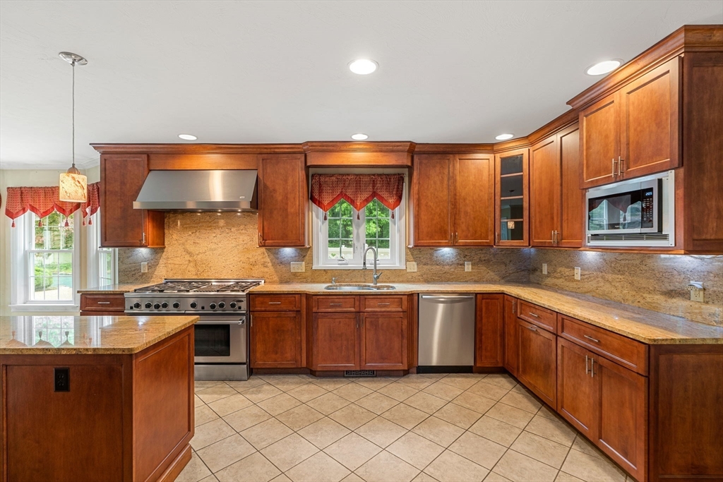 122 Depot Road Boxford, MA 01921 - Photo 8 of 41 a kitchen with stainless steel appliances granite countertop wooden cabinets and a stove top oven
