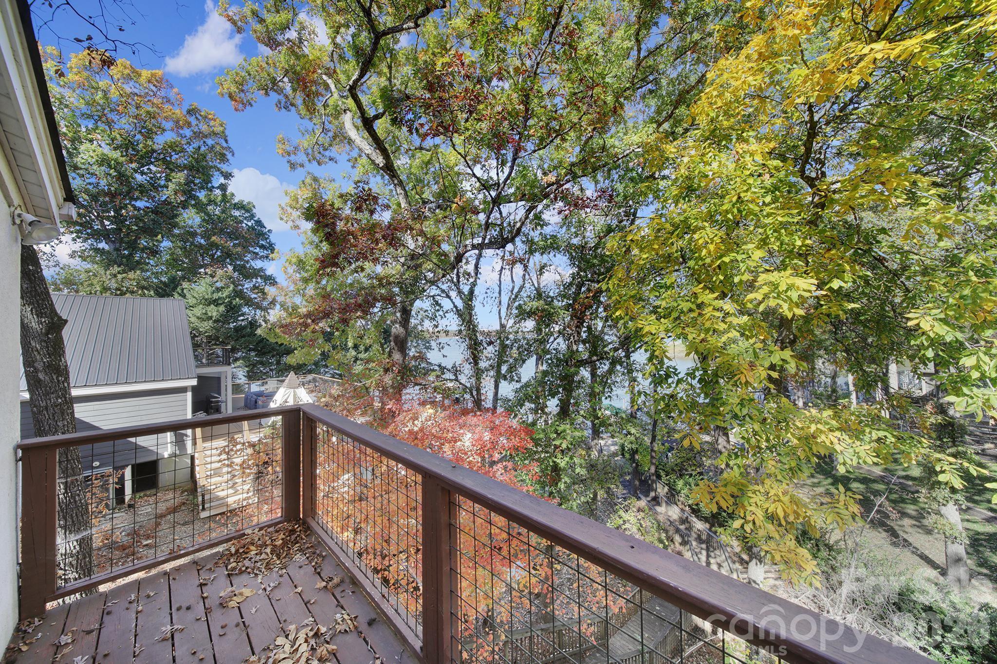 7005 Tega Cay Drive Tega Cay, SC 29708 - Photo 26 of 48 a view of a balcony with wooden fence and floor