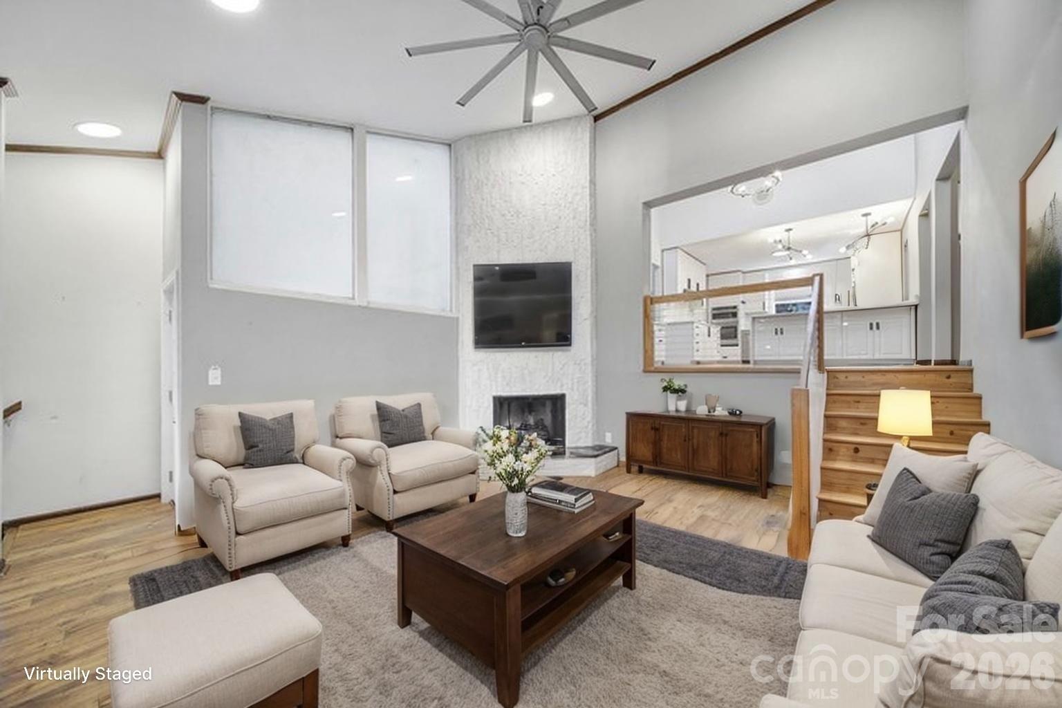 7005 Tega Cay Drive Tega Cay, SC 29708 - Photo 28 of 48 a living room with furniture and a fireplace