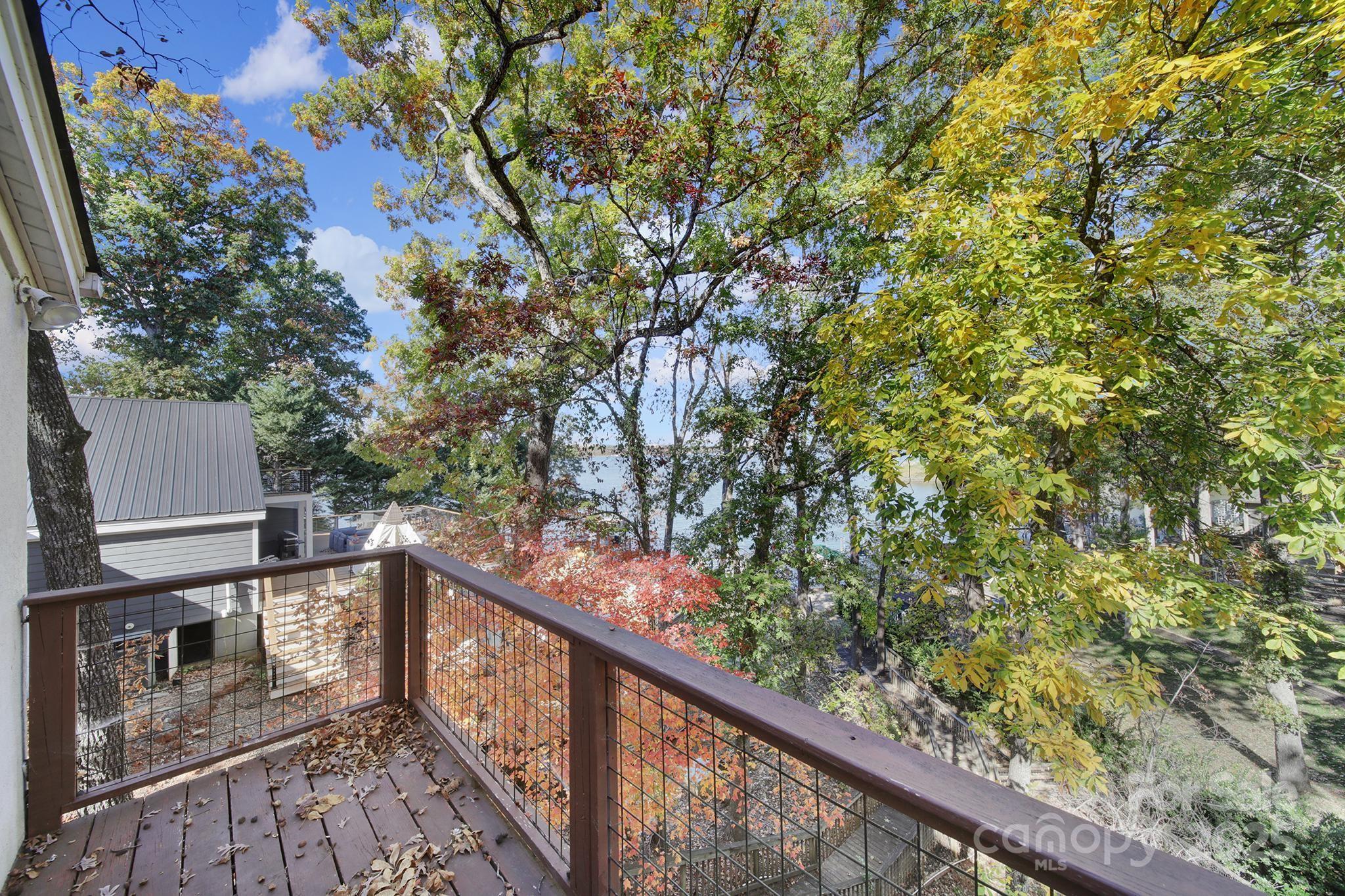 7005 Tega Cay Drive Tega Cay, SC 29708 - Photo 29 of 48 a view of a balcony with wooden fence and floor