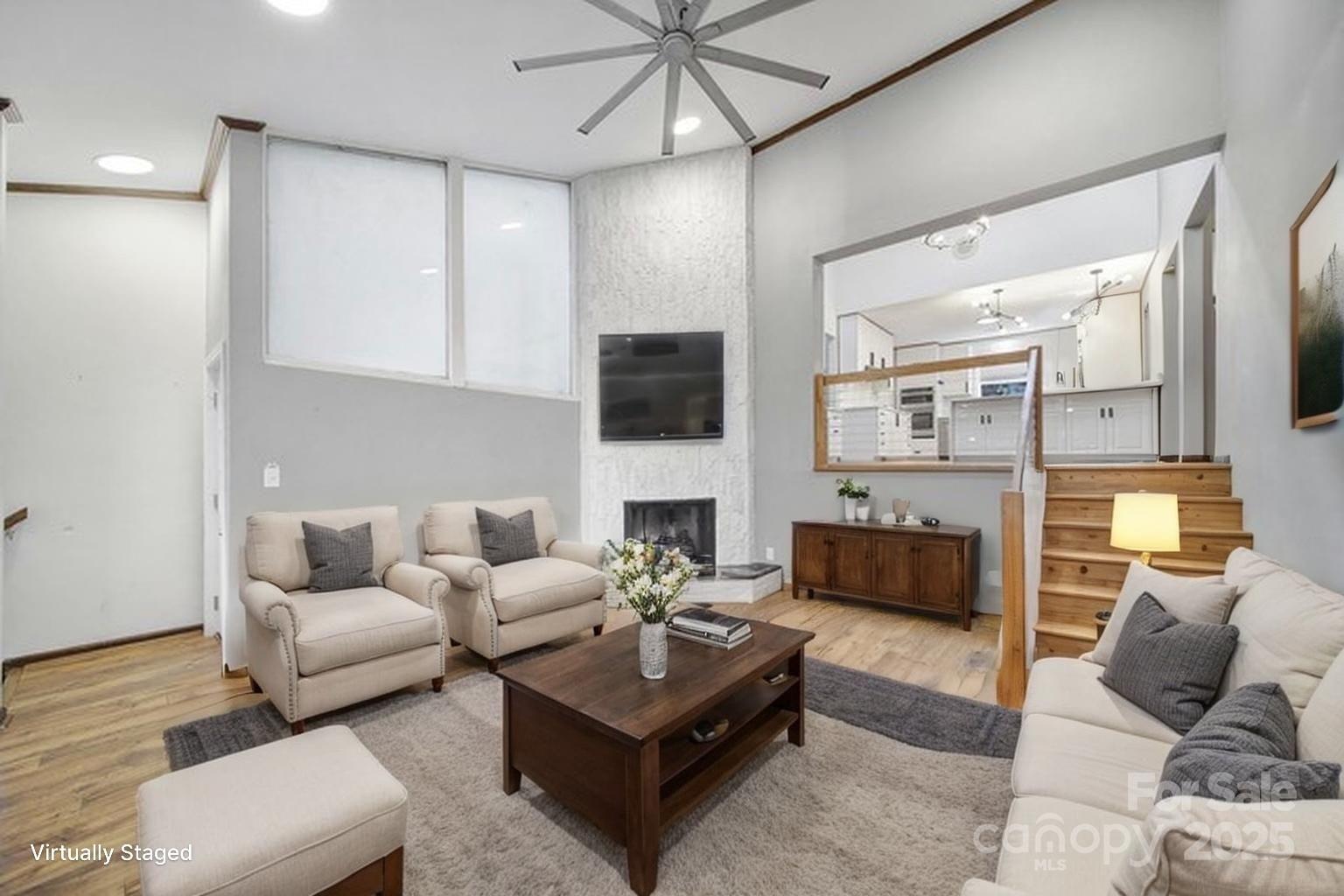 7005 Tega Cay Drive Tega Cay, SC 29708 - Photo 31 of 48 a living room with furniture and a fireplace