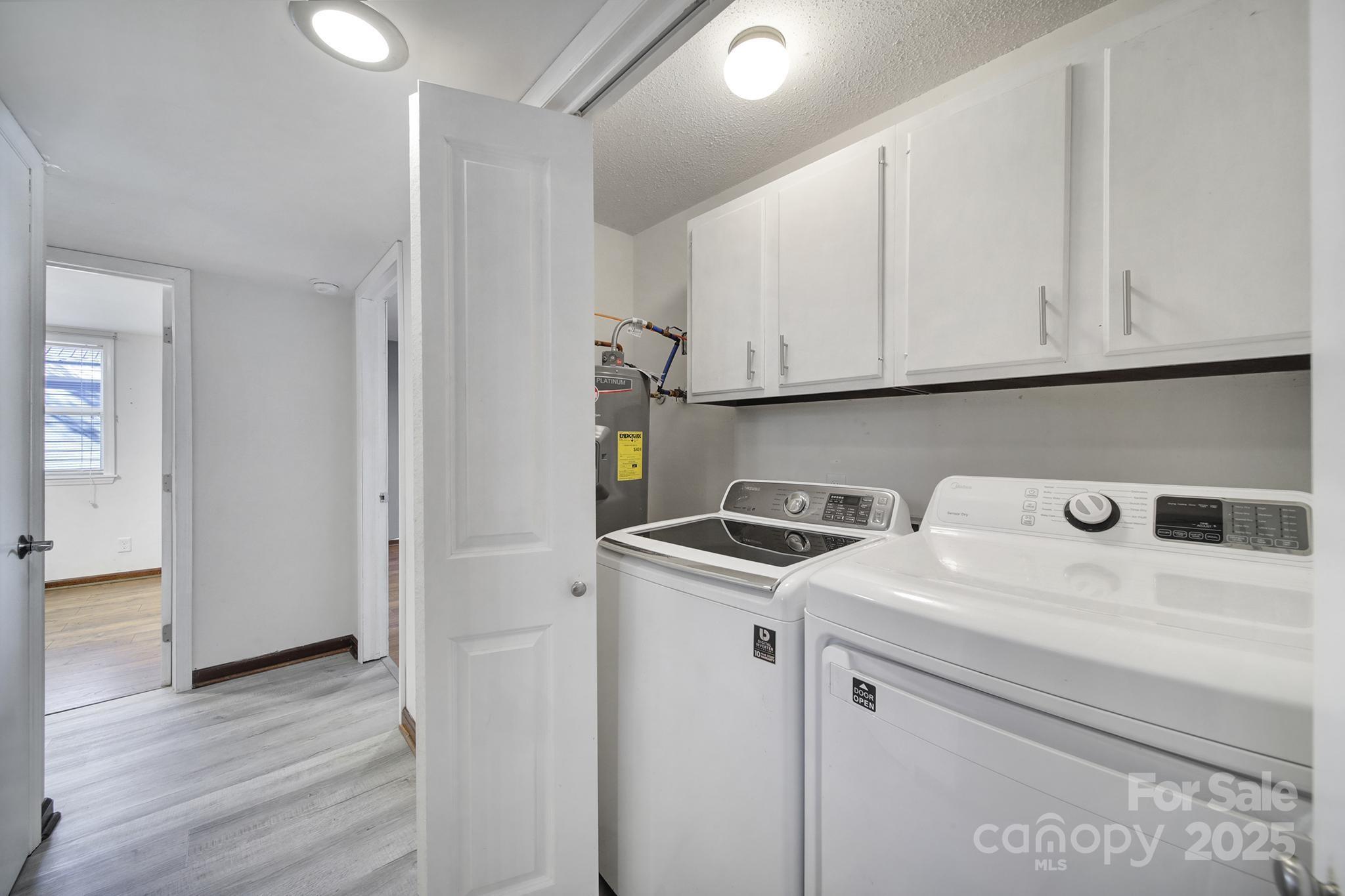 7005 Tega Cay Drive Tega Cay, SC 29708 - Photo 36 of 48 a utility room with dryer and washer