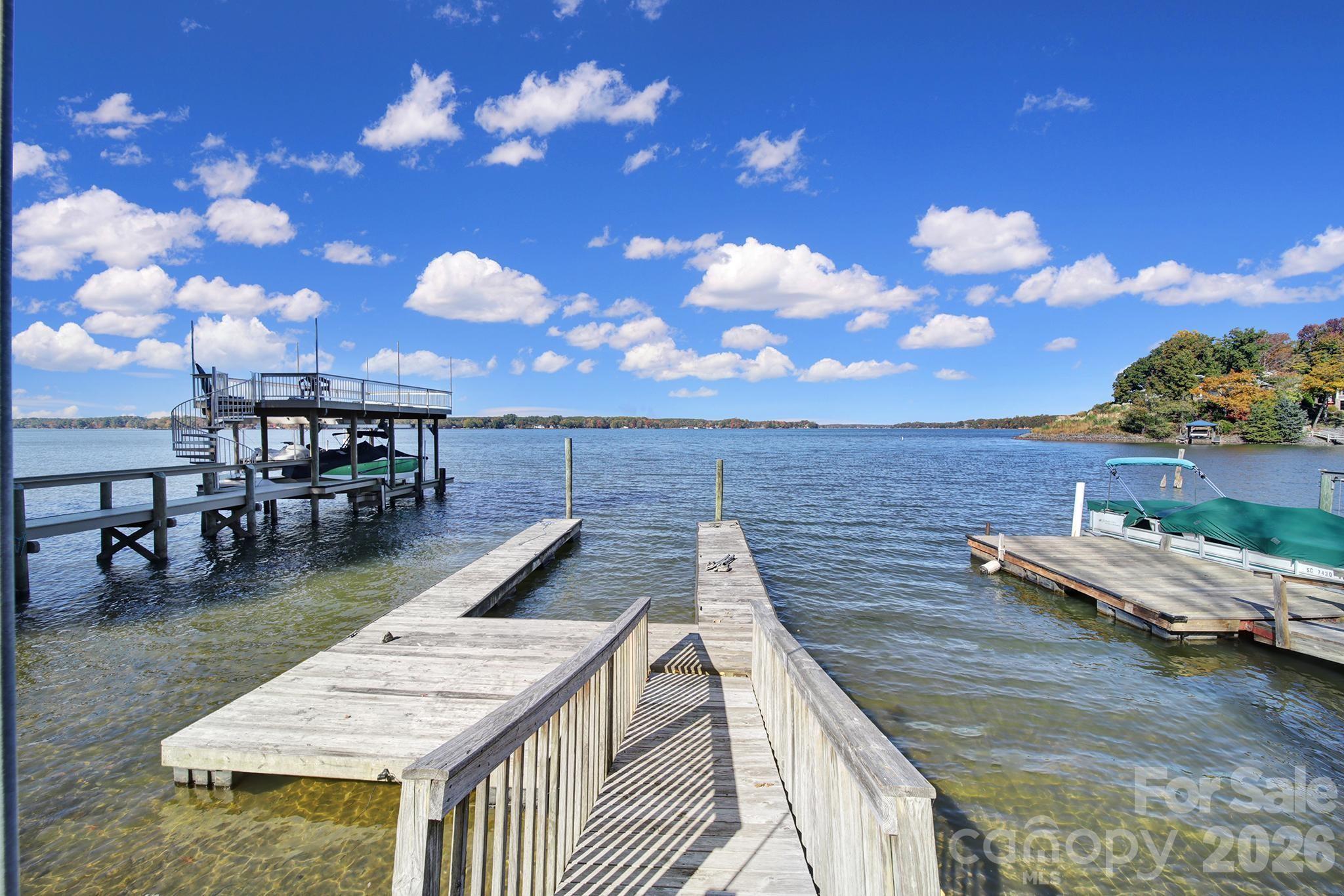 7005 Tega Cay Drive Tega Cay, SC 29708 - Photo 4 of 48 a view of a swimming pool with lounge chairs