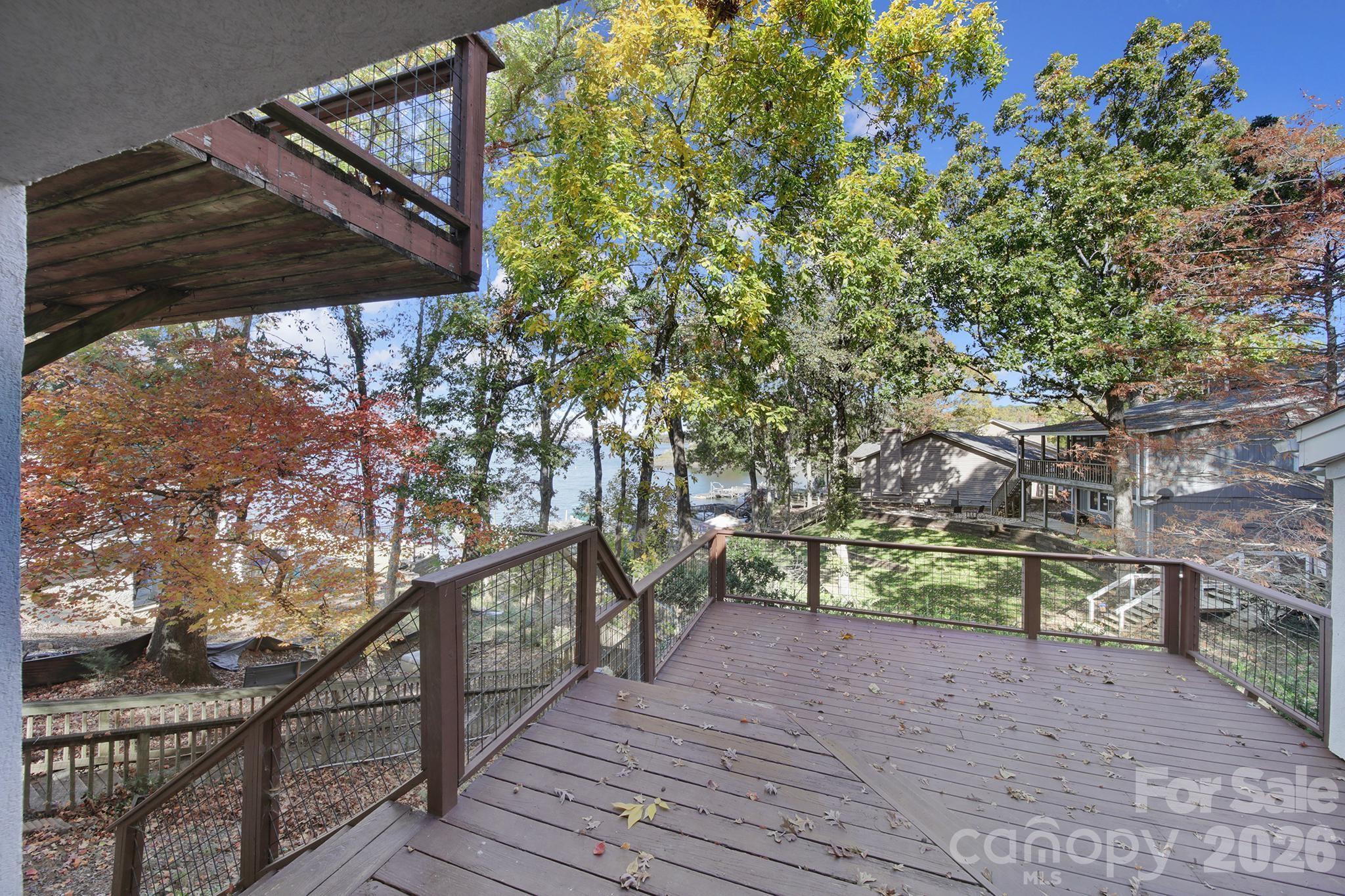 7005 Tega Cay Drive Tega Cay, SC 29708 - Photo 45 of 48 a view of a wooden deck and a yard