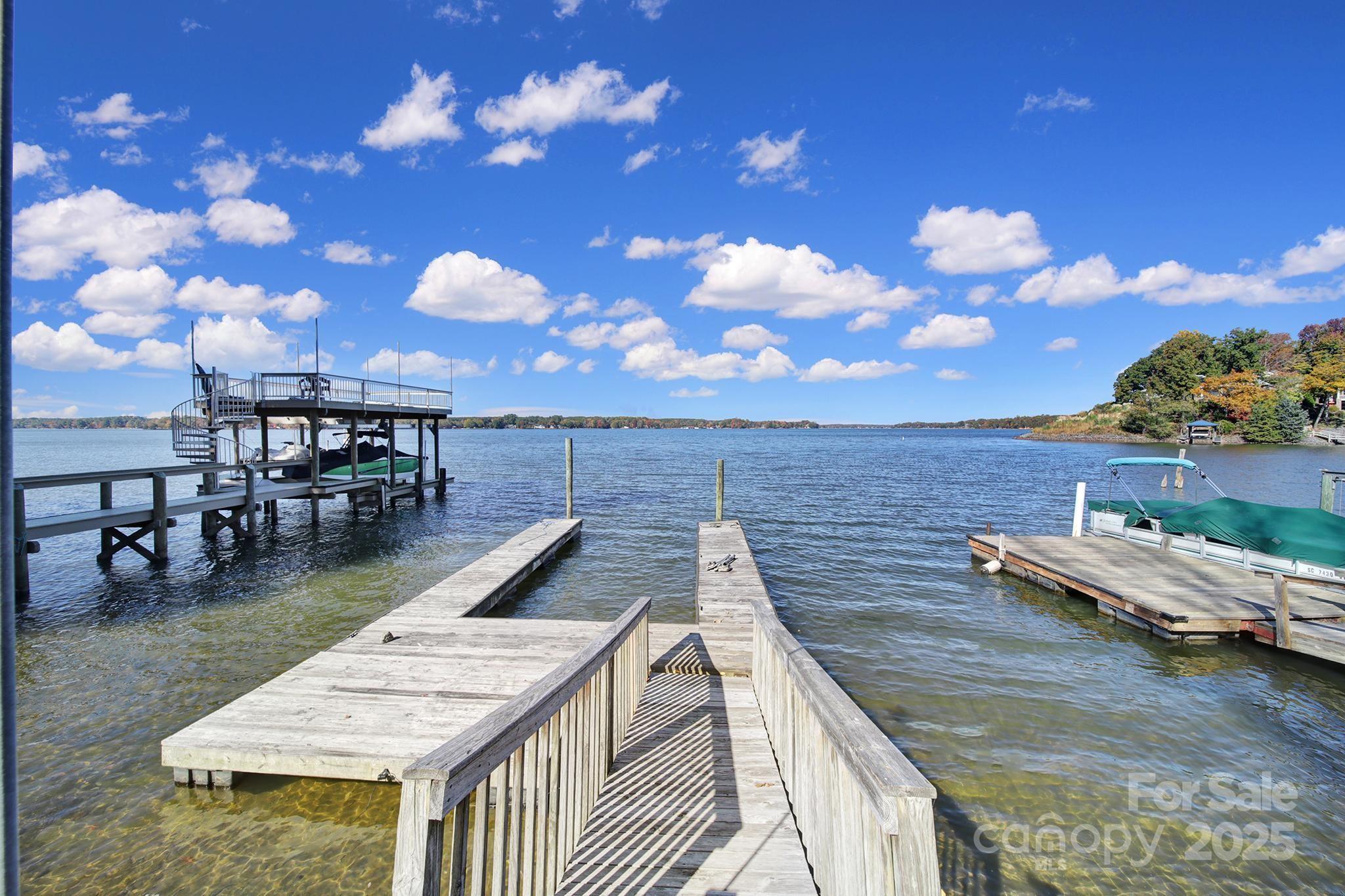 7005 Tega Cay Drive Tega Cay, SC 29708 - Photo 5 of 48 a view of a swimming pool with lounge chairs