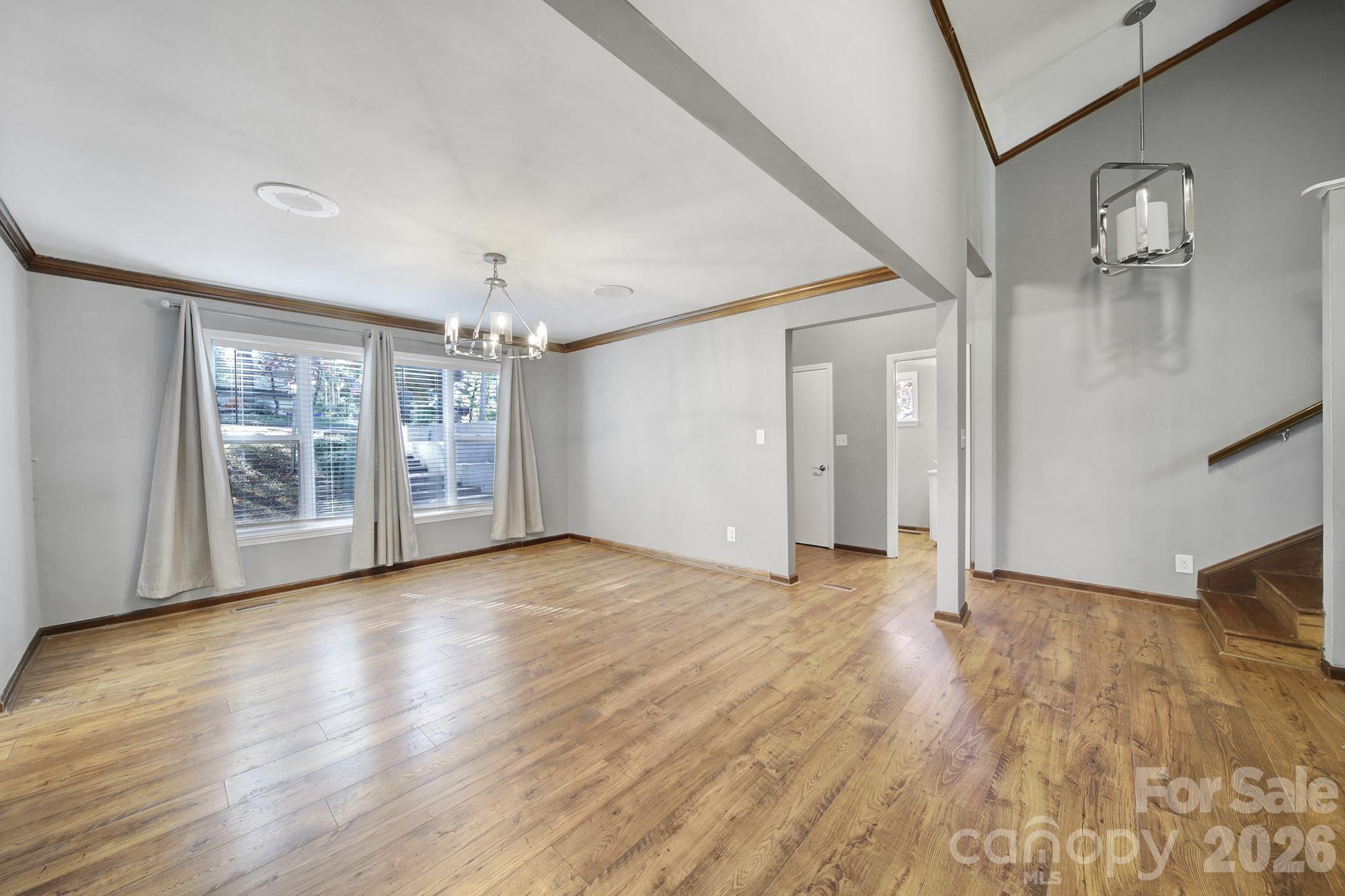 7005 Tega Cay Drive Tega Cay, SC 29708 - Photo 9 of 48 a view of an empty room with window and wooden floor