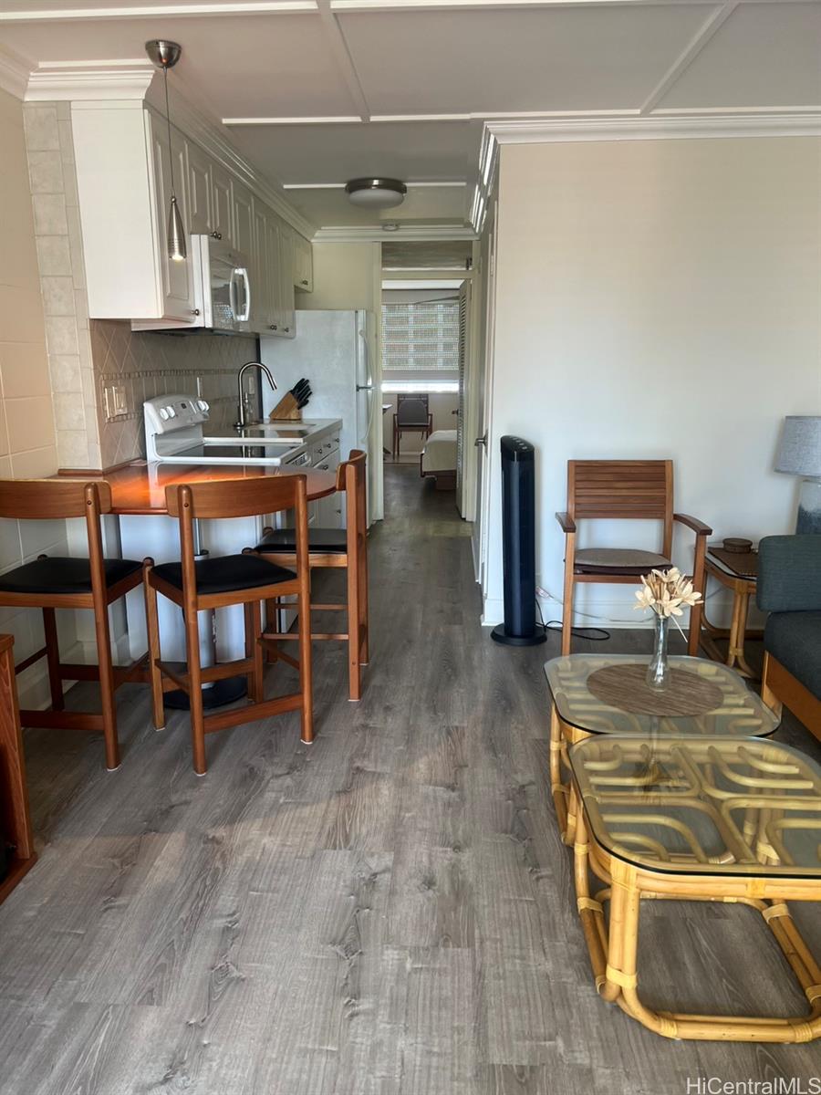425 Ena Road, Unit B1002 Honolulu, HI 96815 - Photo 6 of 20 a kitchen with stainless steel appliances granite countertop a stove and a refrigerator