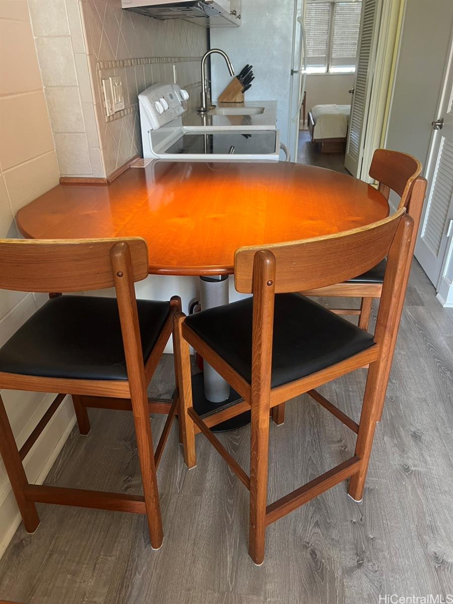 425 Ena Road, Unit B1002 Honolulu, HI 96815 - Photo 7 of 20 a view of a room with wooden floor