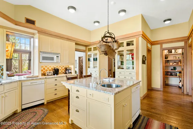 a bedroom with a bed and glass door