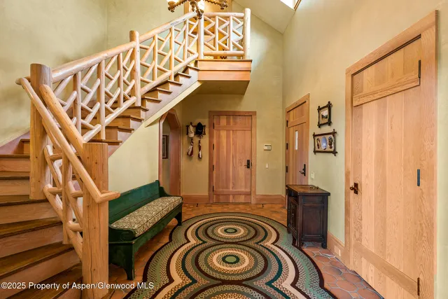 a bedroom with furniture and flat screen tv