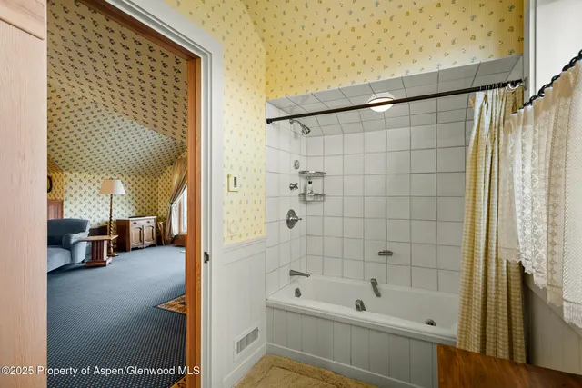 a kitchen with granite countertop white cabinets and sink