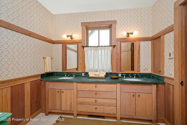 a bed room with a bed and a window